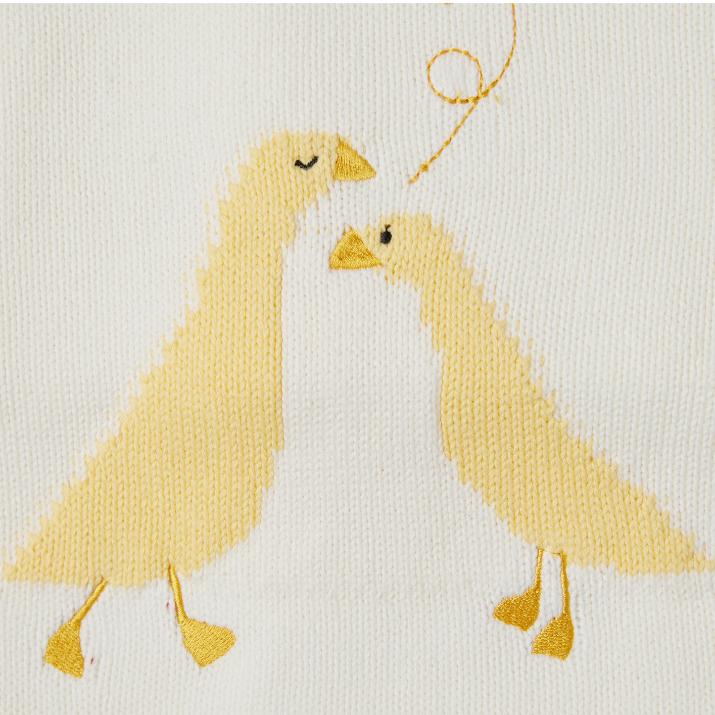 Detalle Cobija tejida patos amarilla para bebe